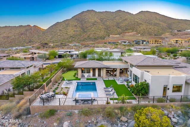 exterior space featuring a mountain view and a patio