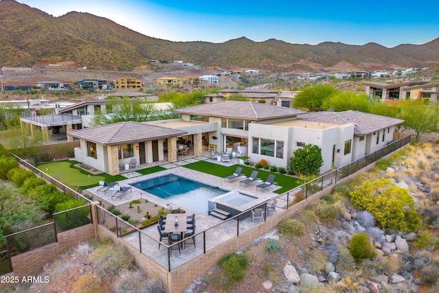 view of pool with a patio area and a mountain view