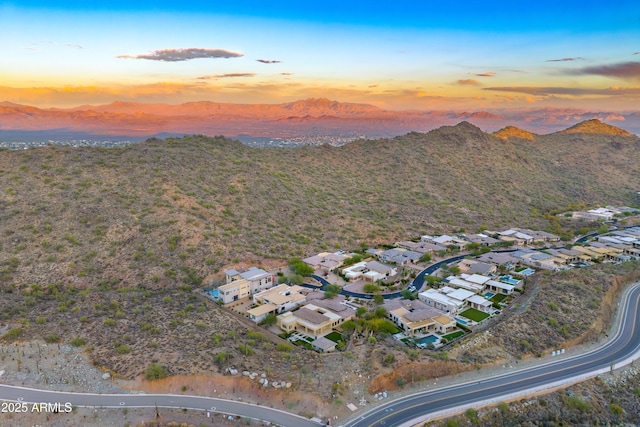 aerial view at dusk with a mountain view