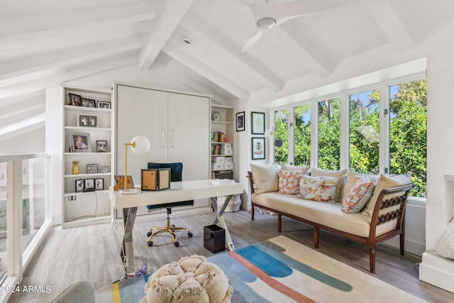 office area featuring hardwood / wood-style flooring, ceiling fan, and vaulted ceiling with beams