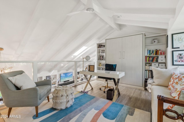 office area featuring hardwood / wood-style flooring, built in shelves, ceiling fan, and vaulted ceiling with beams