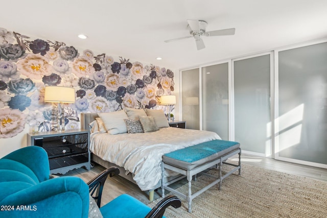 bedroom with ceiling fan and wood-type flooring