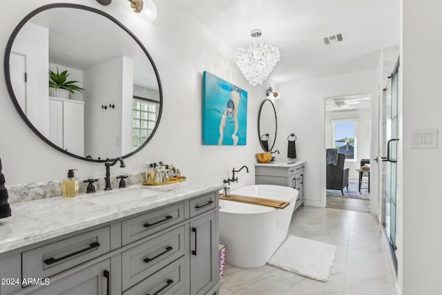 bathroom with ceiling fan, independent shower and bath, and vanity