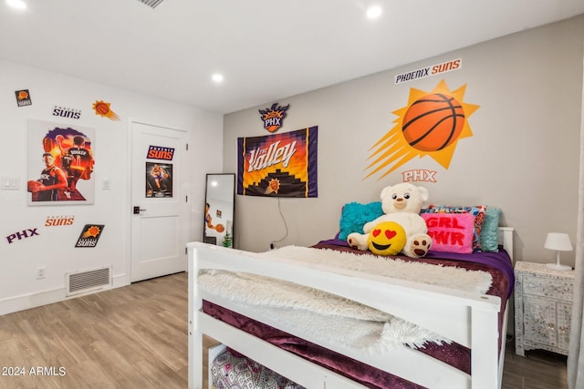 bedroom featuring wood-type flooring