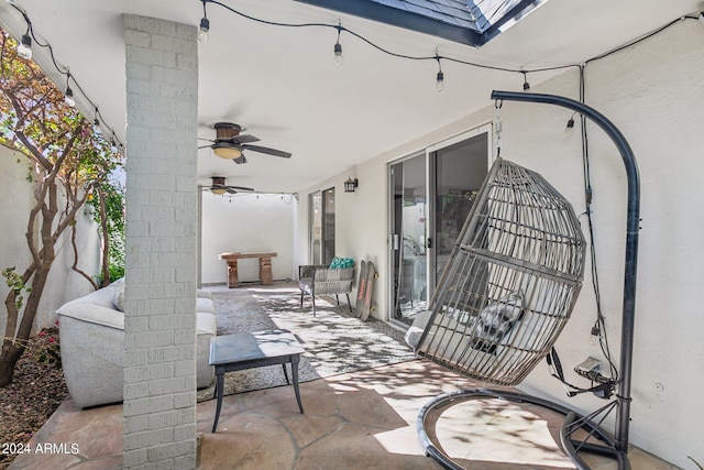 view of patio / terrace featuring ceiling fan