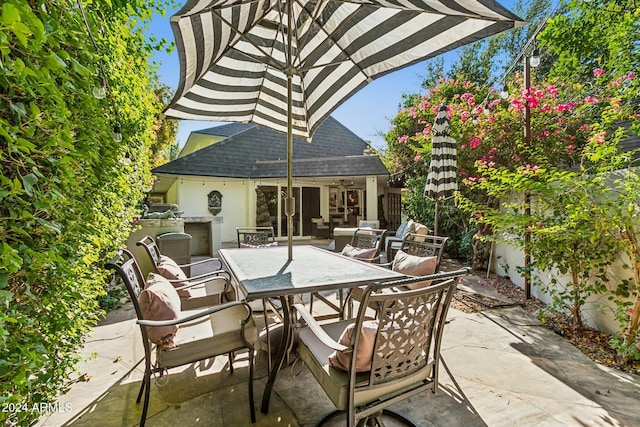 view of patio / terrace featuring exterior kitchen