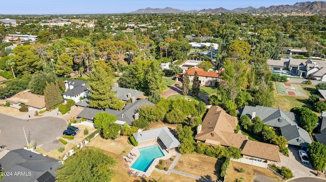 birds eye view of property featuring a mountain view