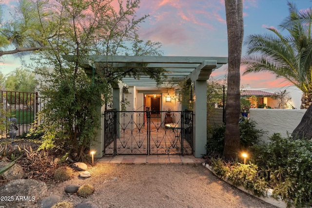 view of gate featuring a fenced front yard