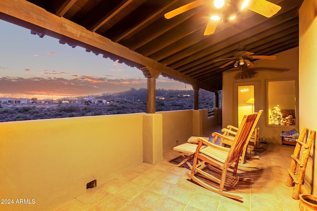 patio terrace at dusk with a balcony