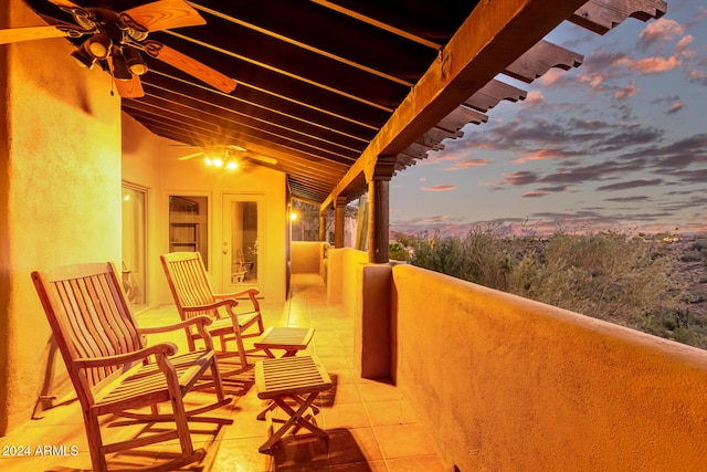 view of balcony at dusk