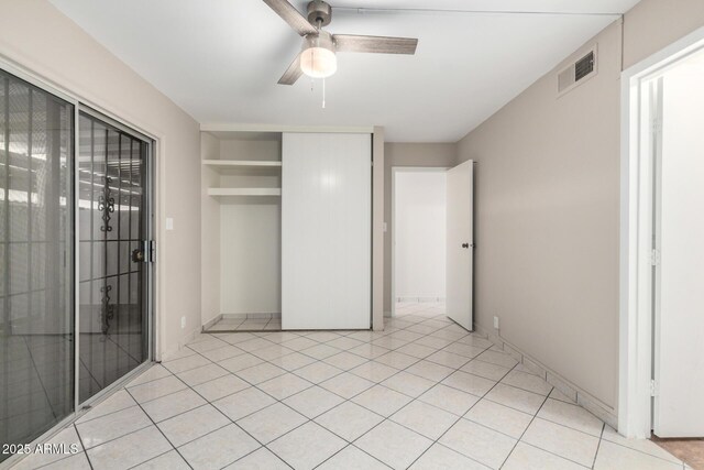 6818 N 35th Ave Unit C, Phoenix, AZ 85017 - unfurnished bedroom featuring a ceiling fan, a closet, and light tile patterned floors