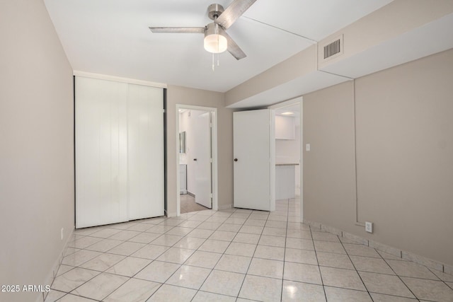 6818 N 35th Ave Unit C, Phoenix, AZ 85017 - unfurnished bedroom featuring light tile patterned floors, a ceiling fan, baseboards, and connected bathroom