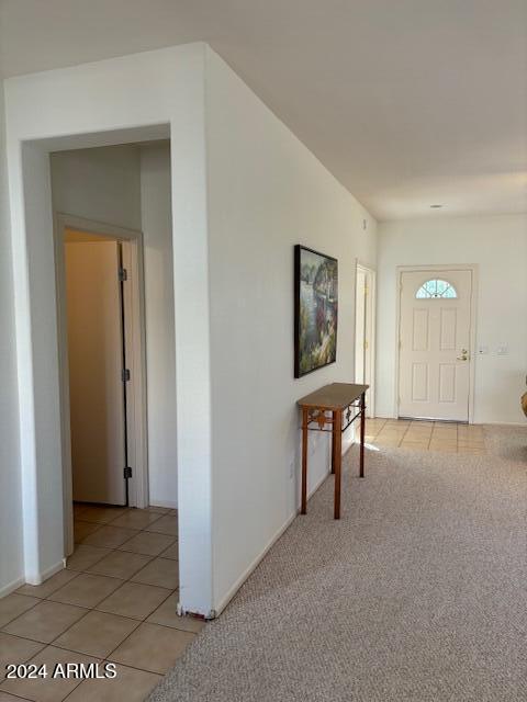 view of carpeted entrance foyer