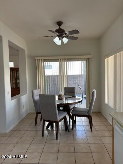 dining room with ceiling fan and light tile patterned floors