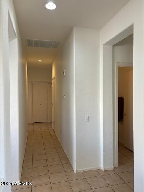 hallway featuring light tile patterned floors