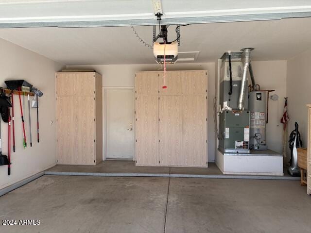 garage featuring water heater, heating unit, and a garage door opener