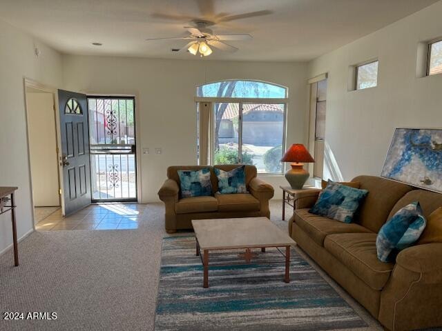 living room featuring ceiling fan and light colored carpet