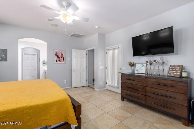 tiled bedroom with ceiling fan