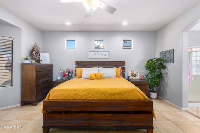 tiled bedroom with ceiling fan