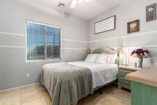 bedroom with light tile patterned flooring and ceiling fan