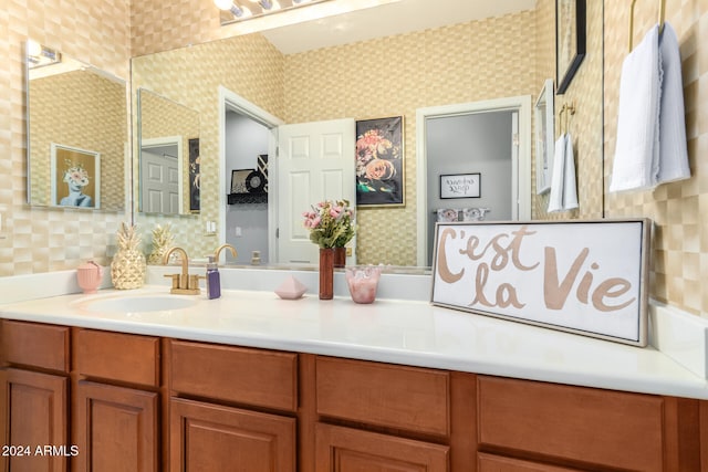 bathroom with vanity and decorative backsplash