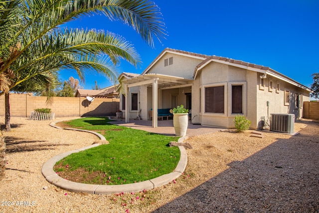 back of house with a yard, a patio, central AC unit, and a pergola