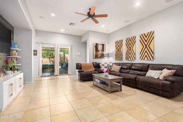 tiled living room with ceiling fan