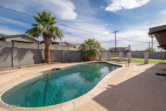 view of pool with a fenced backyard