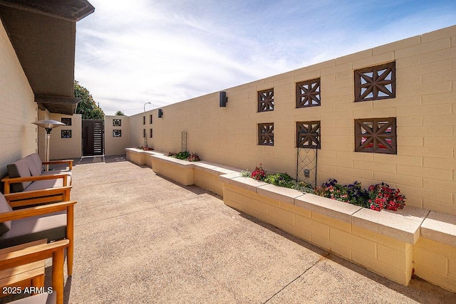 view of patio / terrace featuring fence
