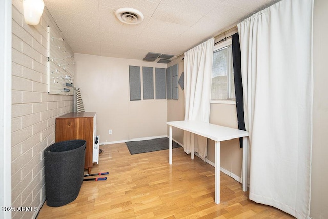 unfurnished room featuring wood finished floors and baseboards