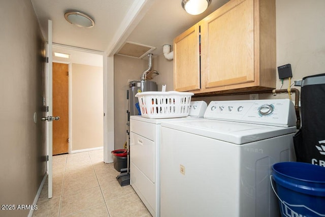 laundry room featuring cabinet space, separate washer and dryer, water heater, light tile patterned floors, and baseboards