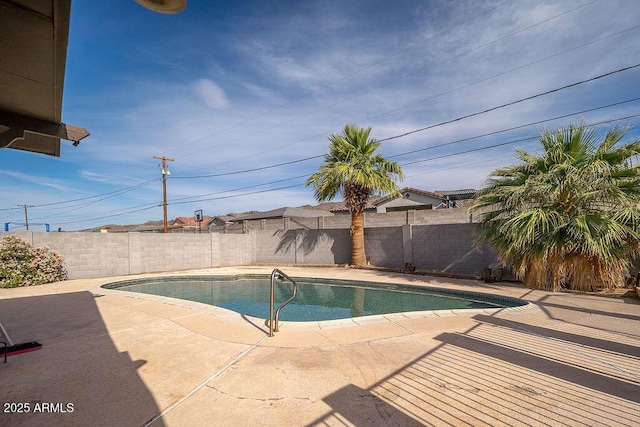 view of pool with a patio area and a fenced backyard