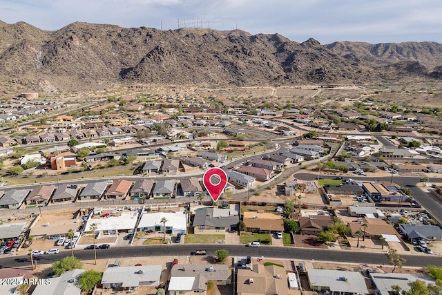 aerial overview of property's location featuring nearby suburban area and mountains