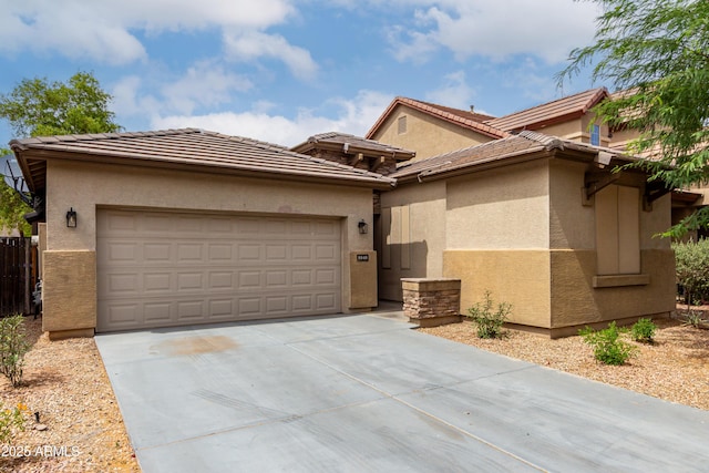 8848 W Cordes Rd, Tolleson, AZ 85353 - view of front facade with driveway, a garage, and stucco siding