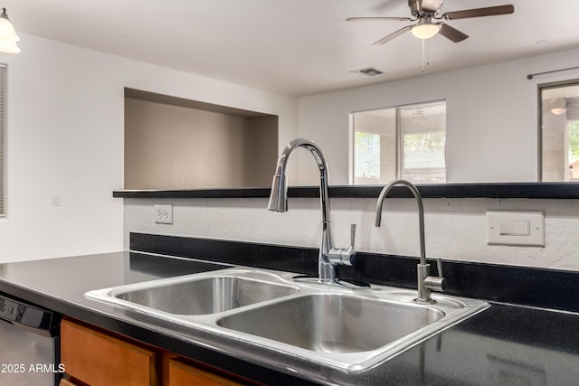 8848 W Cordes Rd, Tolleson, AZ 85353 - kitchen with a sink, stainless steel dishwasher, dark countertops, a ceiling fan, and brown cabinets