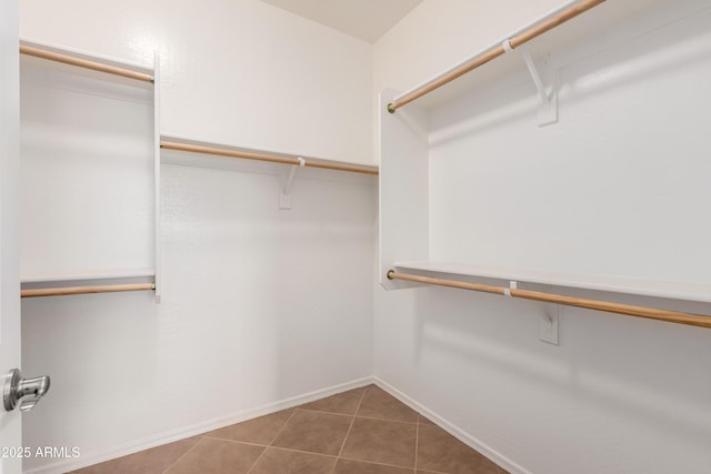 8848 W Cordes Rd, Tolleson, AZ 85353 - spacious closet featuring tile patterned floors