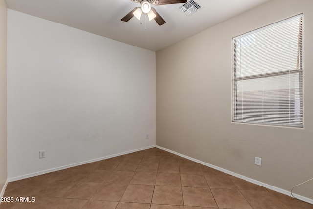 8848 W Cordes Rd, Tolleson, AZ 85353 - spare room with ceiling fan, baseboards, and light tile patterned floors