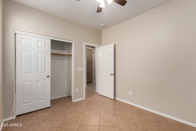 8848 W Cordes Rd, Tolleson, AZ 85353 - unfurnished bedroom featuring light tile patterned flooring, a closet, baseboards, and a ceiling fan