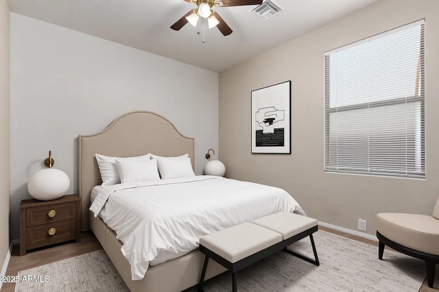 8848 W Cordes Rd, Tolleson, AZ 85353 - bedroom with light wood-style floors, baseboards, and a ceiling fan