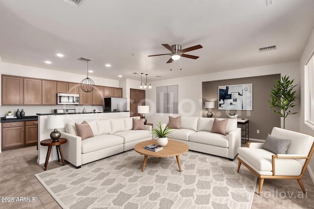 8848 W Cordes Rd, Tolleson, AZ 85353 - living area with a ceiling fan, recessed lighting, and light tile patterned floors
