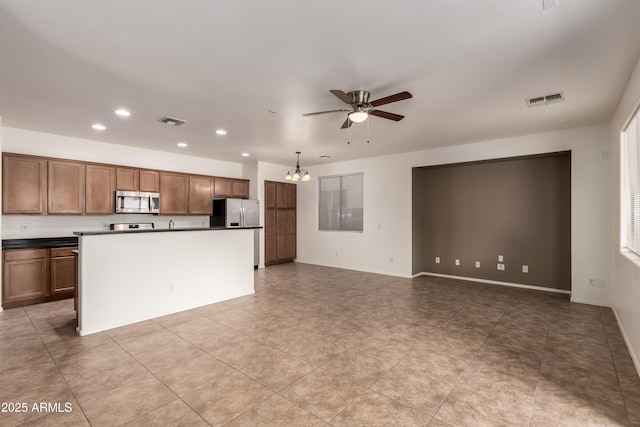 8848 W Cordes Rd, Tolleson, AZ 85353 - kitchen with stainless steel appliances, a ceiling fan, recessed lighting, a chandelier, and dark countertops