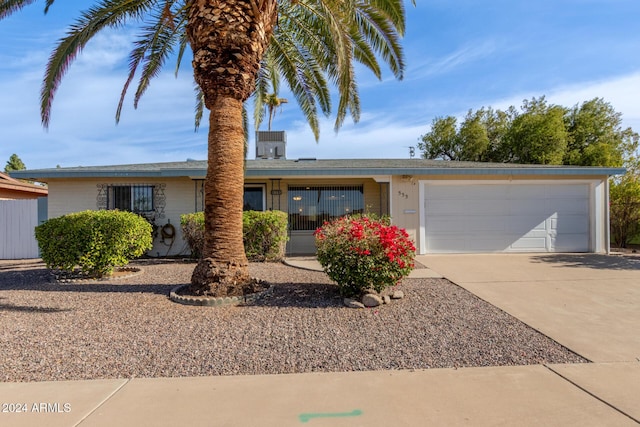 ranch-style home featuring a garage