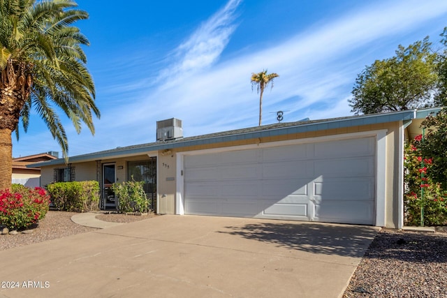 single story home featuring central air condition unit