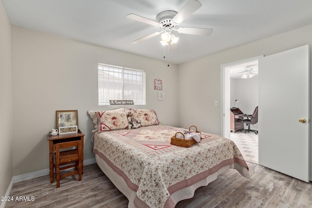 bedroom featuring hardwood / wood-style flooring and ceiling fan