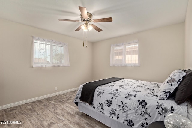 bedroom featuring ceiling fan and light wood-type flooring