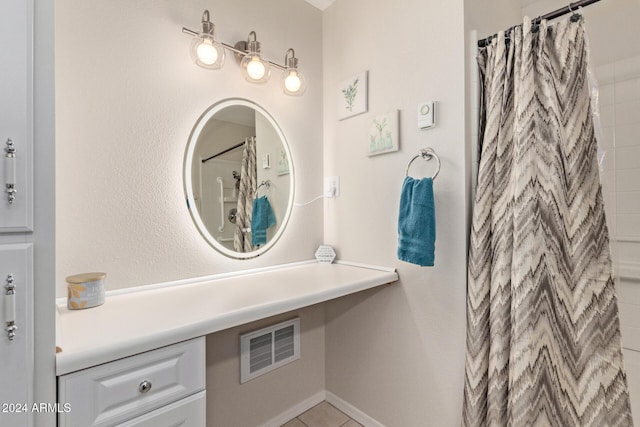 bathroom featuring a shower with shower curtain, vanity, and tile patterned flooring