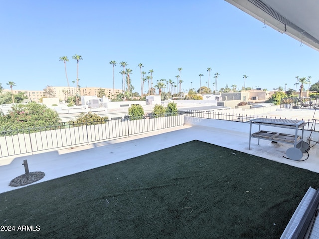 view of pool with a patio and a lawn