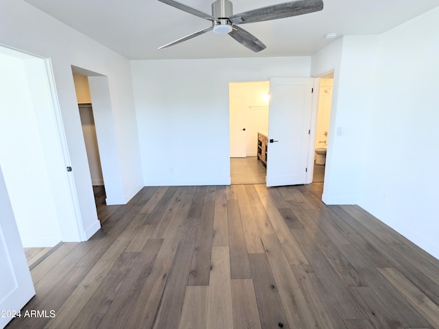 spare room featuring dark wood-type flooring and ceiling fan