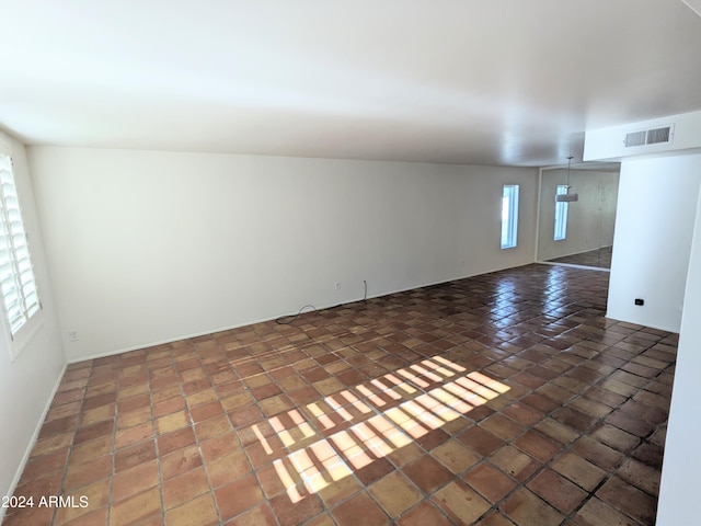 empty room featuring plenty of natural light