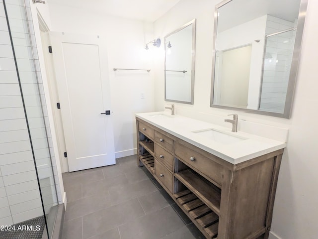 bathroom with vanity, a shower with shower door, and tile patterned flooring